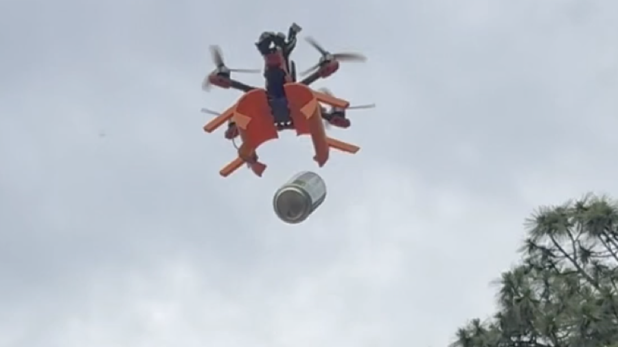 Quadcopter dropping a payload mid-flight